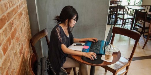 woman-on-laptop-in-cafe-coffee-shop